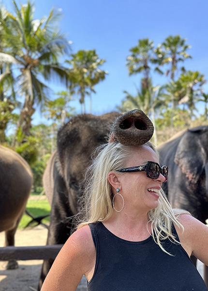 Image of flight attendant, Sherry Martin Peters, sitting inside of an airplane engine. The blog is about learning to pack like a flight attendant.